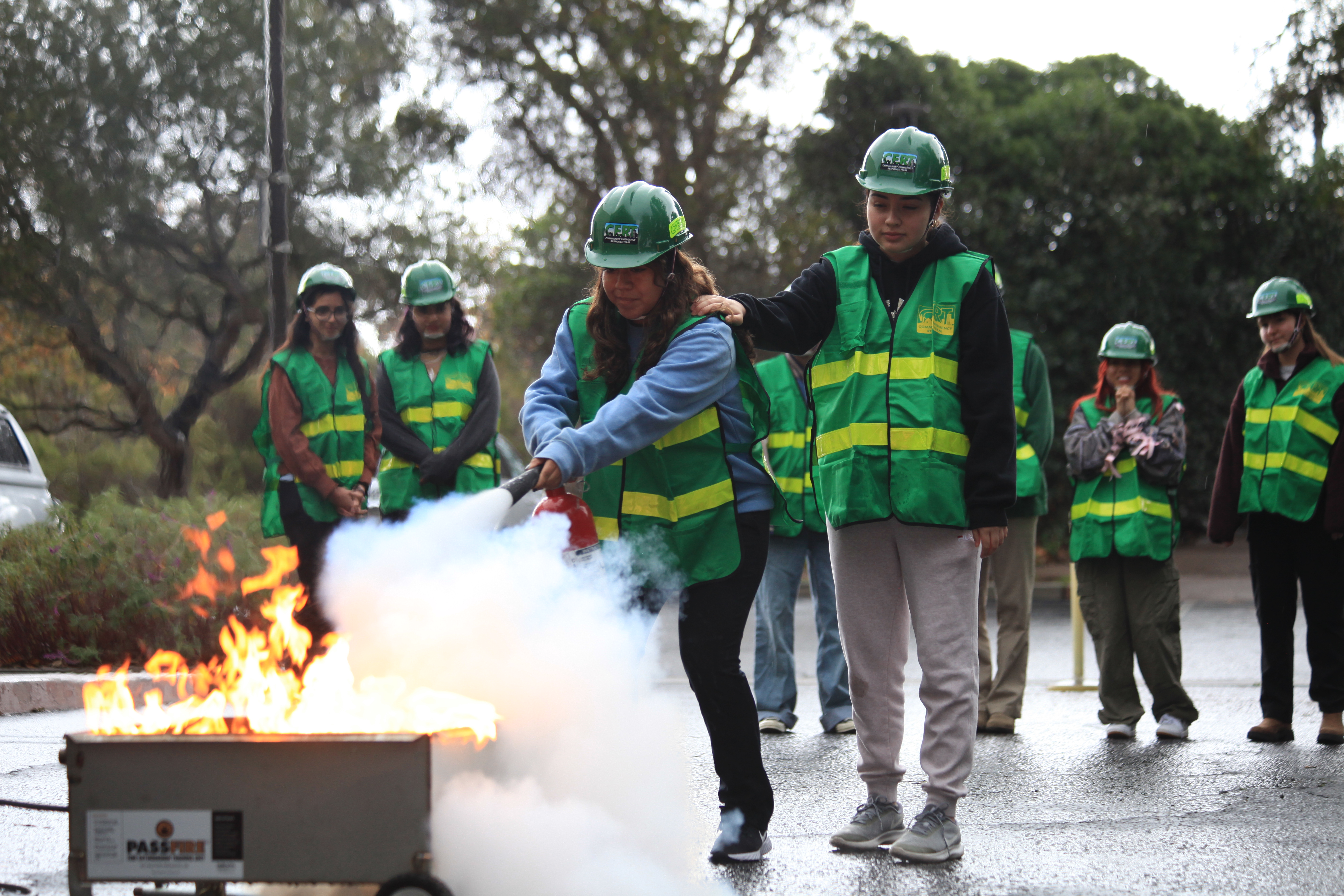 CERTs putting out a fire with a CO2 extinguisher