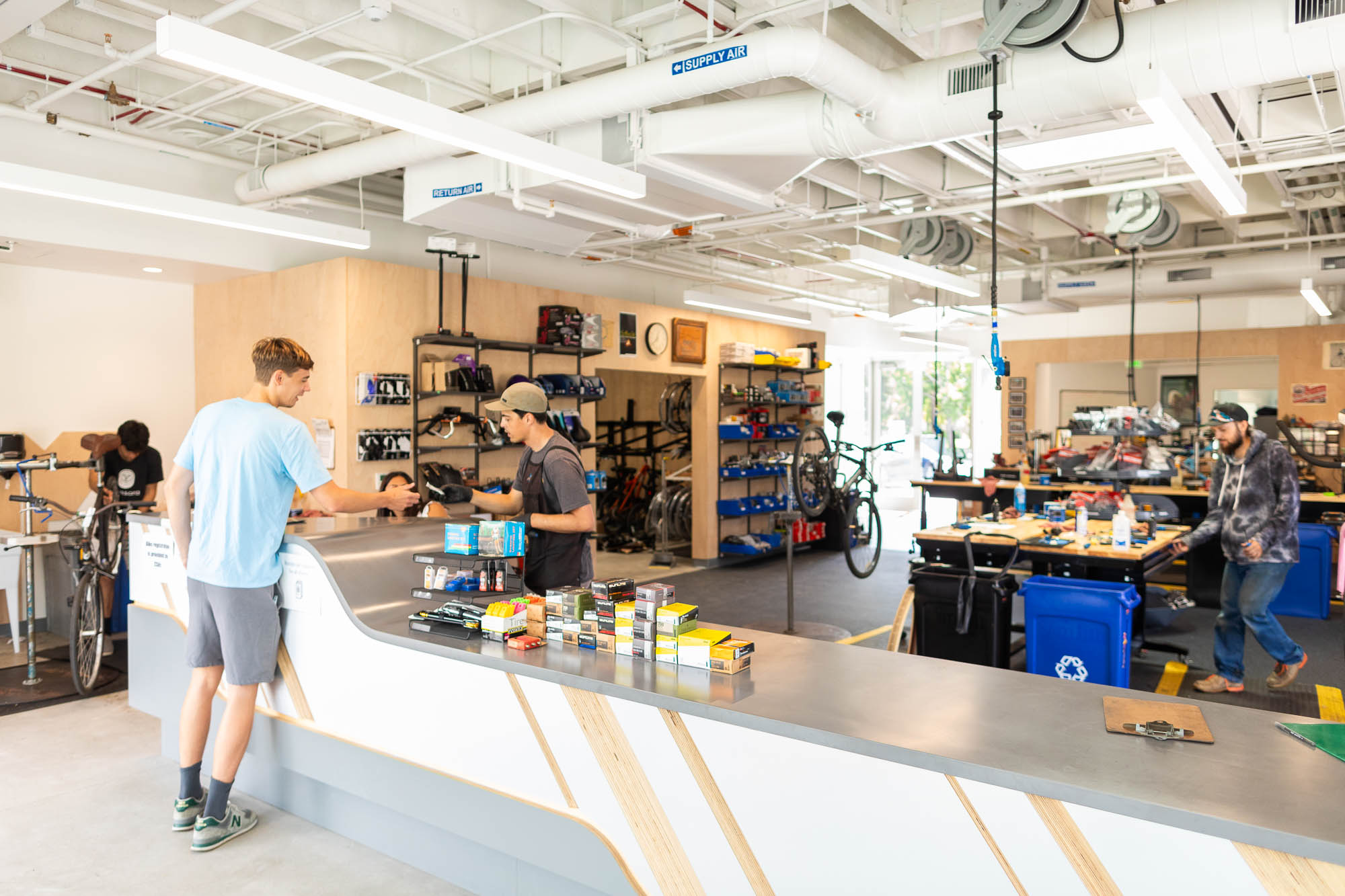 customer being helped in new A.S. Bike Shop