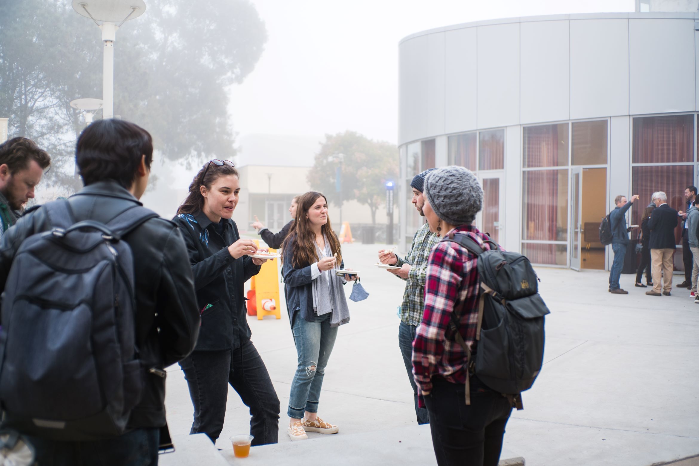 students outside chatting during a lecture